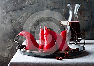 Spiced hibiscus or red wine poached pears. Delicious winter french dessert.