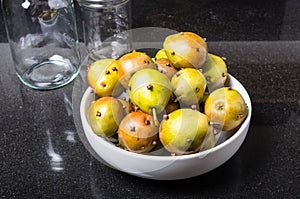 Spiced seckel pears being preserved