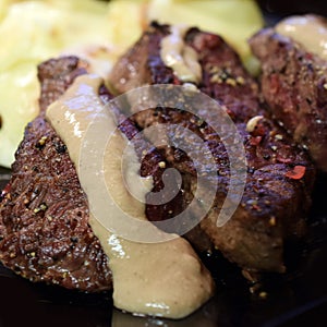 Spiced steak with creamy peppercorn sauce