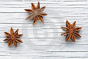 Spices. Anise stars on the vintage wooden background