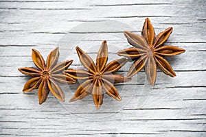 Spices. Anise stars on the vintage wooden background