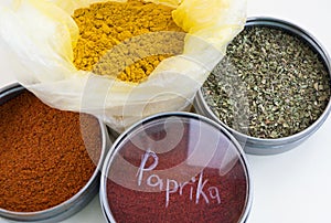 Spices in bowls. Paprika, oregano herbs, turmeric