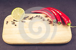 spices and empty cutting board/ spices and empty cutting board on a dark background. Copy space