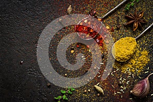 Spices food background. selection variety dry Whole and ground spices on a black background