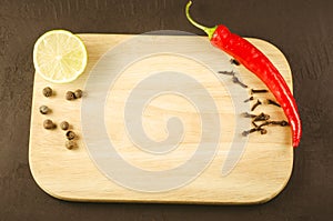 spices, fresh ingredients and empty cutting board/spices, fresh ingredients and empty cutting board. Top view