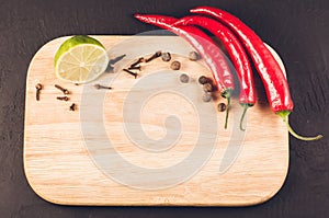 spices, fresh ingredients and empty cutting board/spices, fresh ingredients and empty cutting board. Top view. Copy space