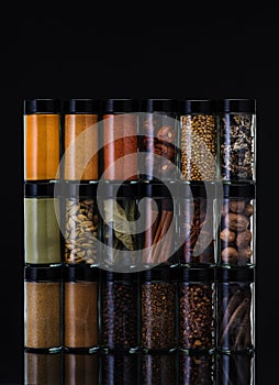 Spices in glass jars.  Spicy and seasonings.