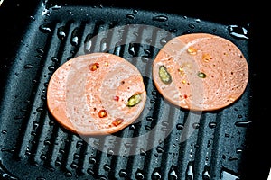 Spices Ham fried in cooking pan