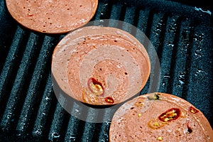 Spices Ham frying in pan