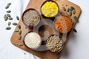 Spices and herbs in ceramic bowls. seasoning. Colorful natural additives. flat lay