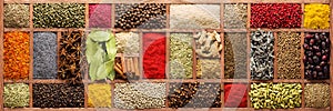 spices and herbs for cooking different dishes. seasoning in wooden box, background, top view