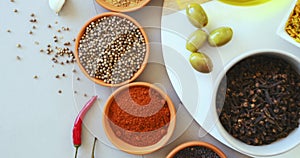 Spices, herbs and curry on table top in kitchen for cooking, food or seasoning collection with color. Top View, powder