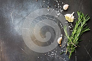 Spices and herbs on a dark stone or slate table. Ingredients for cooking. Food background.