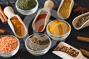 Spices, herbs and food additives on a black background