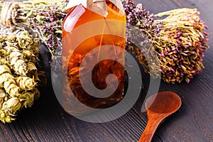 Spices and herbs ingredients in decorative glass bottles,kitchen decoration