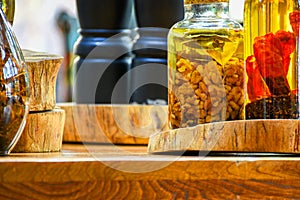 Spices and herbs ingredients in decorative glass bottles,kitchen decoration