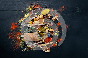 Spices and herbs. A large assortment of spices. Indian cuisine. On the wooden table. Top view.