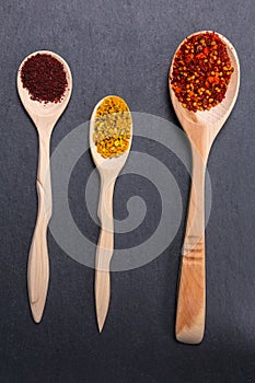 spices and herbs over dark old wood. Cooking ingredients. Food and cuisine concept. vertical photo