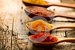 Spices and herbs over wooden background