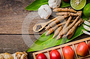 Spices and herbs over wooden background