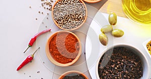 Spices, herbs and powder with top view on table in kitchen for cooking, food or seasoning collection with color. Curry