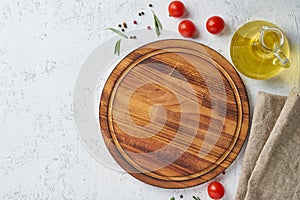 Spices, Herbs and round wooden cutting board on white concrete backdrop. Top view, copy space. Menu, recipe, mock up, banner. Food