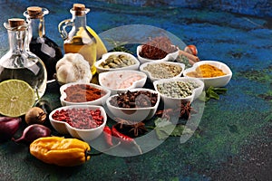 Spices and herbs on table. Food and cuisine ingredients with oil and vinegar