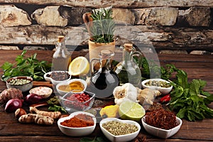 Spices and herbs on table. Food and cuisine ingredients with oil and vinegar