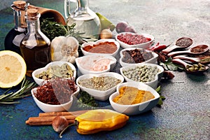 Spices and herbs on table. Food and cuisine ingredients with oil and vinegar