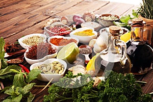 Spices and herbs on table. Food and cuisine ingredients with oil and vinegar