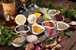 Spices and herbs on table. Food and cuisine ingredients with oil and vinegar