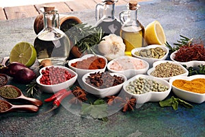 Spices and herbs on table. Food and cuisine ingredients with oil and vinegar