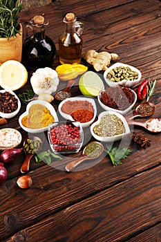 Spices and herbs on table. Food and cuisine ingredients with oil and vinegar