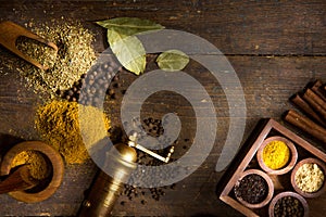 Spices and herbs on wooden table