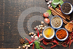 Spices with ingredients on dark background. healthy or cooking c
