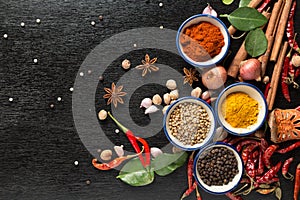 Spices with ingredients on dark background. healthy or cooking c