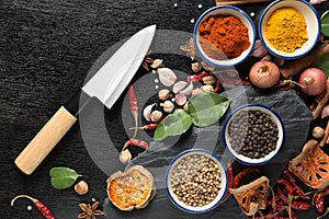 Spices with ingredients on dark background. healthy or cooking c