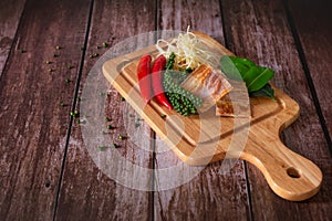 Spices with ingredients  Stir-Fried Spicy and herb with dried fish fillet on a cutting board with wooden dark background. Thai