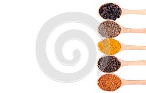 Spices mix on wooden spoons isolated on a white background. Top view
