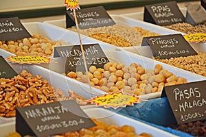 Spices and nuts in food market photo