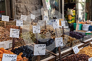 Spices, nuts and sweets shop on the market in Amman downtown, Jordan. Choice of Arabic spices on the Middle East bazaar, Jordan