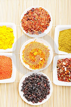 Spices in a rows on mat