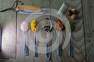 Spices salt pepper oregano nutmeg and cerry food use photo