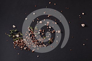 Spices scattered on a black background
