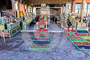 Spices and scented leaves of different colors for sale in a souk in the Medina in Marrakech