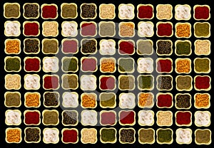 Spices in square green ceramic bowls on black background contrasting picture