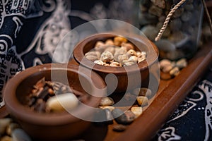 spices in wooden bowl with batic cloth in the background