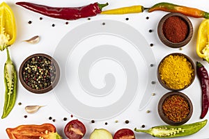 Spices in wooden bowl, garlic, vegetables, anise stars isolated on white background. Space for text