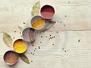 Spices on a wooden light background photo