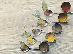 Spices on a wooden light background photo